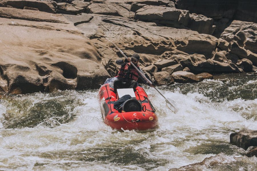 A person white water rafting on the Orange River.